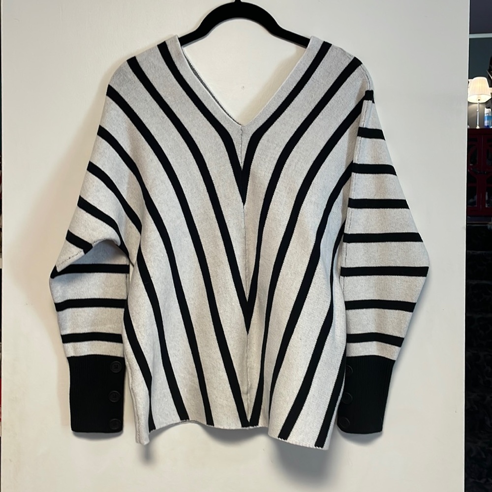 NEW.  Black and White Sweater.  Size Medium